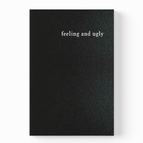 A black textured notebook with the words 'feeling and ugly' printed in white serif font near the top, shown against a plain white background.